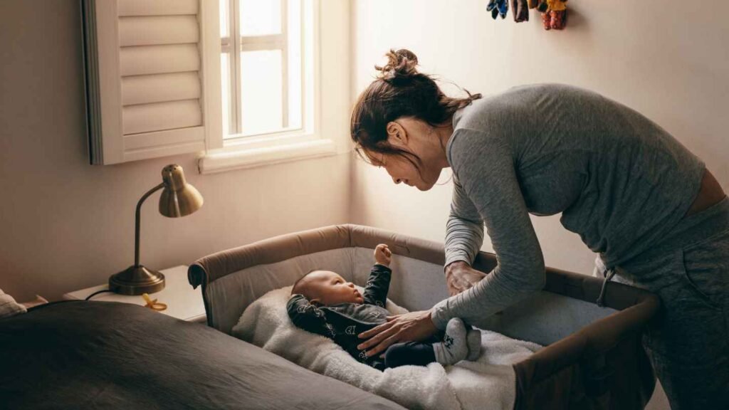 Mom About to Pick Up Her Baby Who Wake Up During Sleep Training