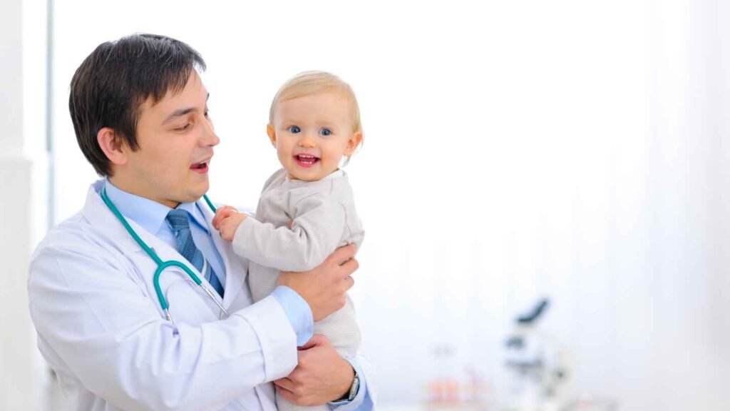Paeditrician Holding a Happy Baby
